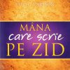 Mana care scrie pe zid